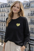 Pull noir cœur doré détails manches